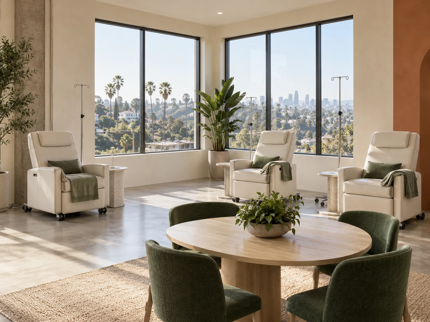 Illustrative Juniper IV lounge with corner windows, medical recliners, and a communal table